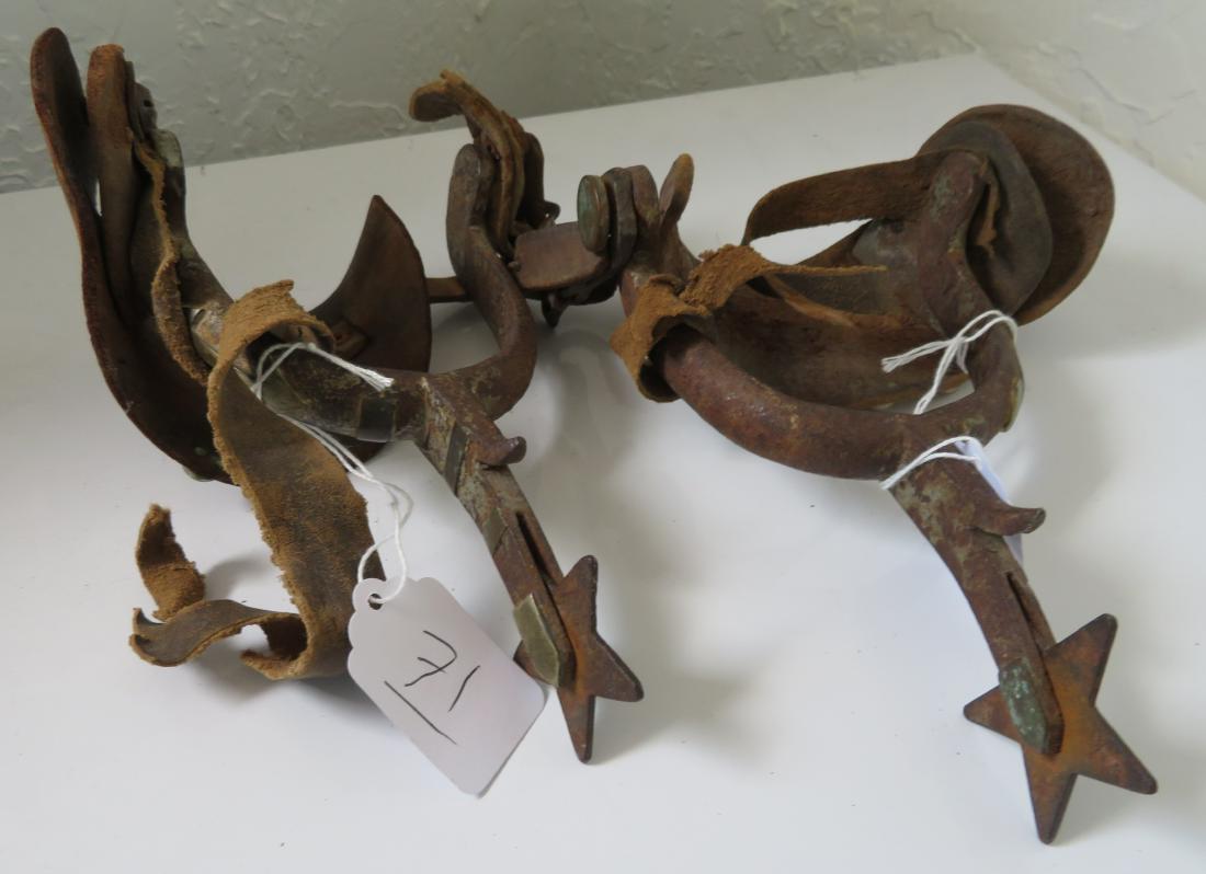Antique Matched Pair Mexican Spurs: Antique Matched Pair Mexican Spurs, early 20th century items. Made of leather, steel, silver, the items measure 8" x 6 1/2" x 2". Marked EB. With silver inlay. Condition: Worn, heavy patina, see image