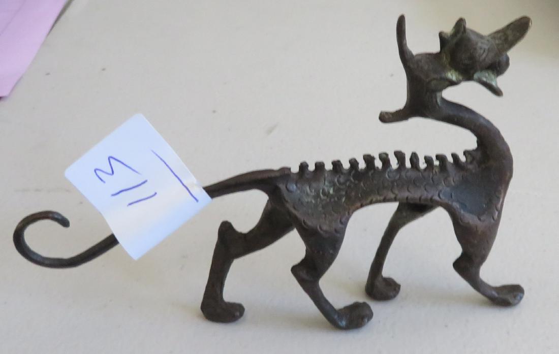 Chinese Dragon Figure: Chinese Dragon Figure, early Han dynasty. Made of bronze, the item measures 6" x 4" x 1". China. Condition: Nice patina, see images. Shipping: $25.50 w/insurance and signature, double-boxed, due to va