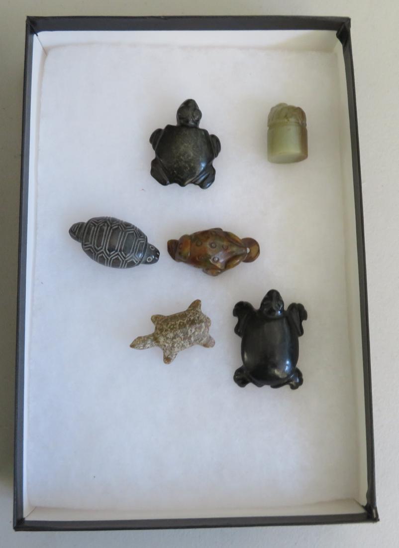 6 Chinese Carvings: 6 Chinese Carvings, Han & Zhou dynasties. Made of Jade, the items measure from 1" to 3". China. Frame not included. Condition: Good, see images. Shipping: $26.50 w/insurance and signature.
