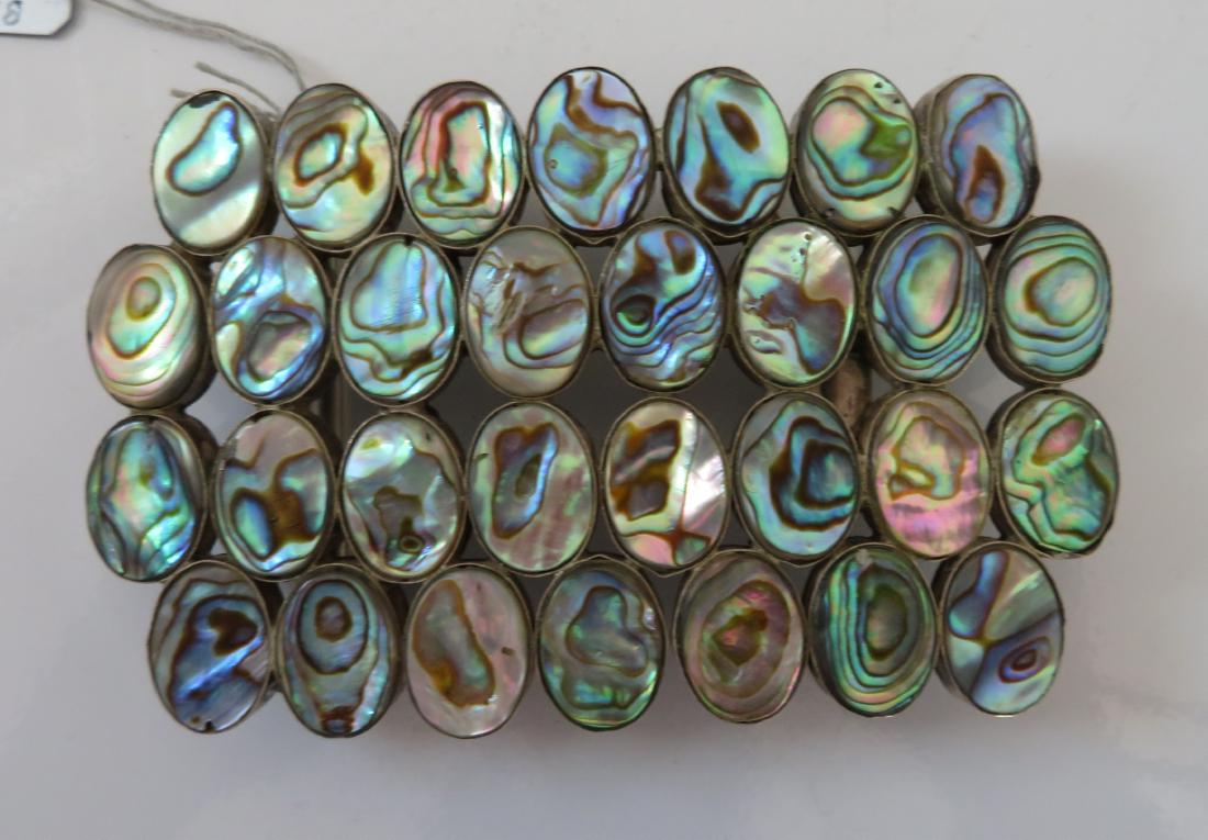 Mexican Abalone & Sterling Belt Buckle: Mexican Abalone & Sterling Belt Buckle, c. 1940s. Made of sterling silver and abalone, the item measures 4" x 2 1/2" x 7/8". Mexico. Condition: Good, see images. Shipping: $15.50 w/insurance and signa