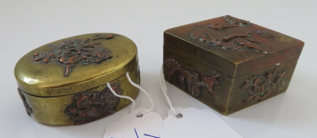 2 Japanese Copper Boxes: 2 Japanese Copper Boxes, 19th century items. Made of copper and brass, the items measure 2 1/4" x 1 1/2" and 1 3/4" x 2 1/2". Nice pill boxes. Japan. Condition: Good, patina and wear, see images. Ship