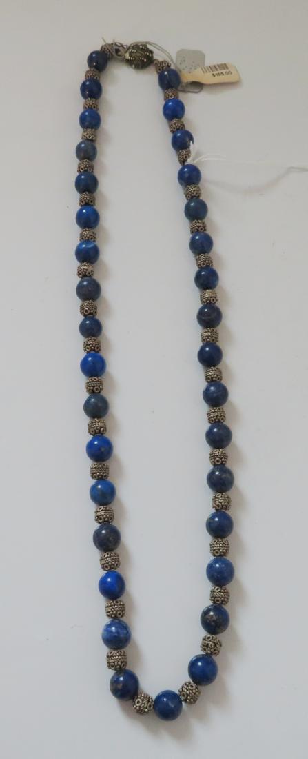 Sterling Silver & Lapis Lazuli Stone Bead Necklace: Sterling Silver & Lapis Lazuli Stone Bead Necklace, antique item. Made of lapis lazuli and sterling silver, the item hangs 11" as worn. Afghanistan. Condition: Good, see images. Shipping: $15.50 w/ins