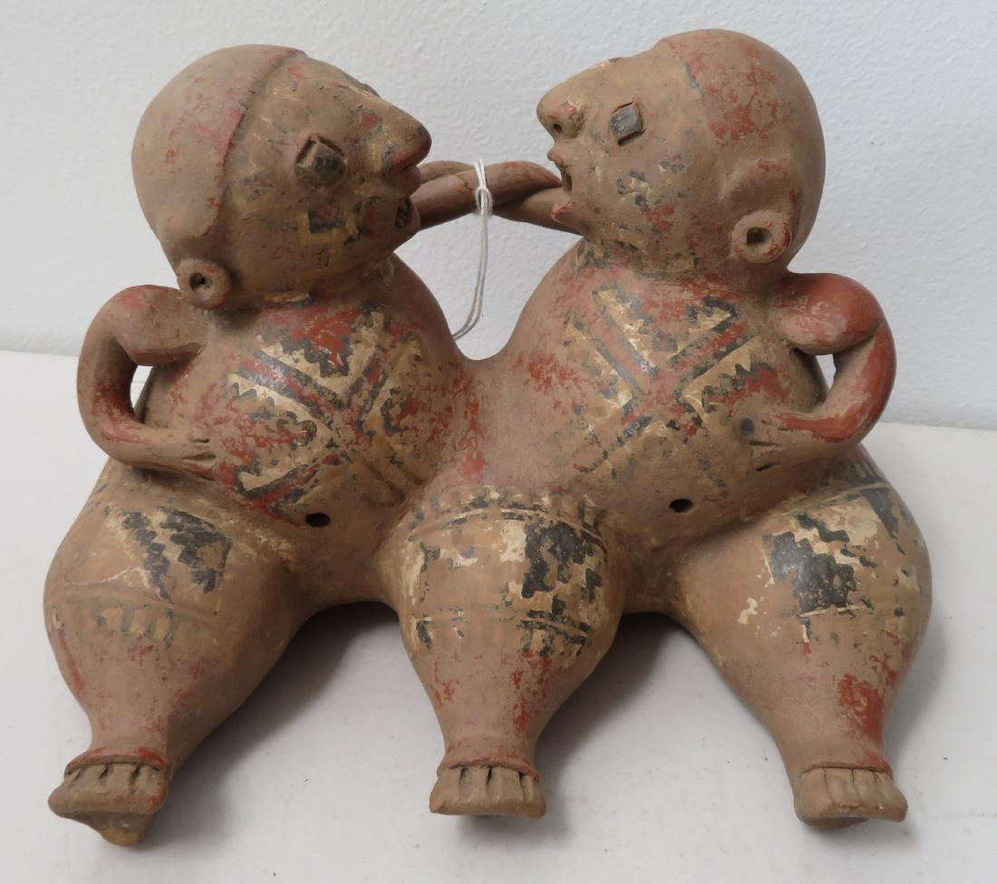 Conjoined Clay Figure: Conjoined Clay Figure, pre-Columbian item. Made of clay and paint, the item measures 9" x 5" x 5". Chupicuaro, Mexico. Condition: Arms cracked and glued, see images. Shipping: $40.00 USA estimate only