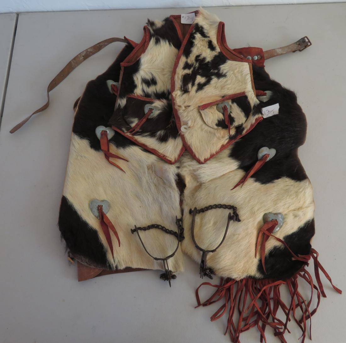 Childs Hair-on Vest & Chaps w/Spurs: Childs Hair-on Vest & Chaps w/Spurs, c. 1940s. Made of calf hide, the chaps measure 18" x 20" and the vest measures 11" x 15". Spurs measures 6" long. Tucson, Arizona. Condition: Fringe missing on one