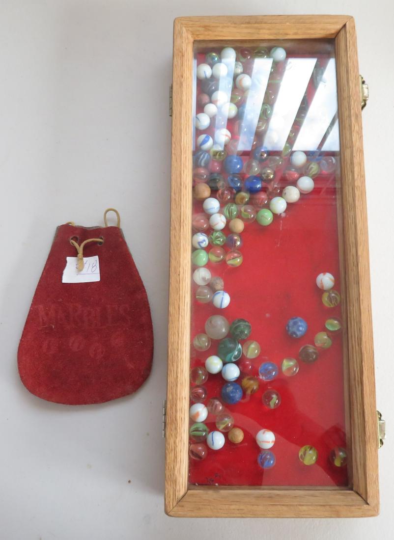 Antique Marble Collection w/Old Leather Bag: Antique Marble Collection w/Old Leather Bag, c. 1860s. Made of glass and lead, the items mostly measure 1/2". Germany, USA. Victorian swirl, agate, also lead soldiers, old leather bag reads marbles on