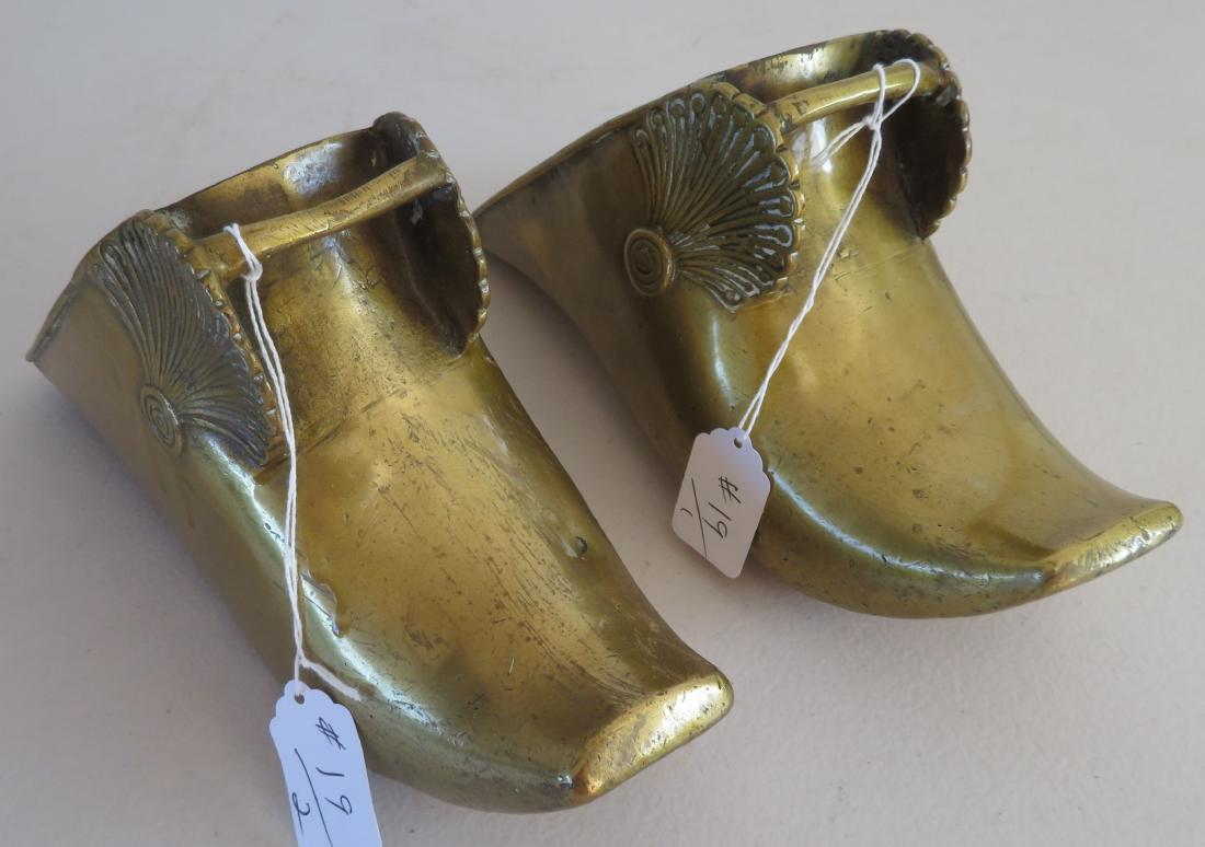 Pair of Antique Spanish Stirrups: Pair of Antique Spanish Stirrups, c. 200 years old. Made of brass, the items measures 10 1/2" x 4" x 5". Spanish. Shell design on each. Condition: Patina and wear, see images. Shipping: $28.50 w/insur