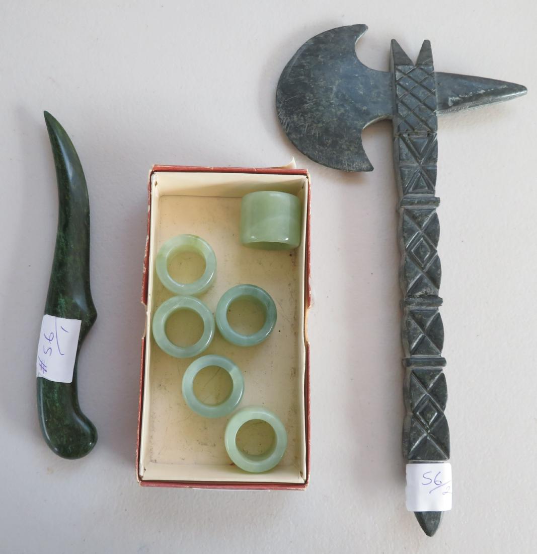Chinese Jade Collection: Chinese Jade Collection, c. 1900. Made of jade, the axe measures 12" x 6", the bow pulls measures 1 1/2" x 1 1/4". China. Bow string pulls, dagger, monolithic axe. Jade dagger measures 8 1/2" x 2'. Co