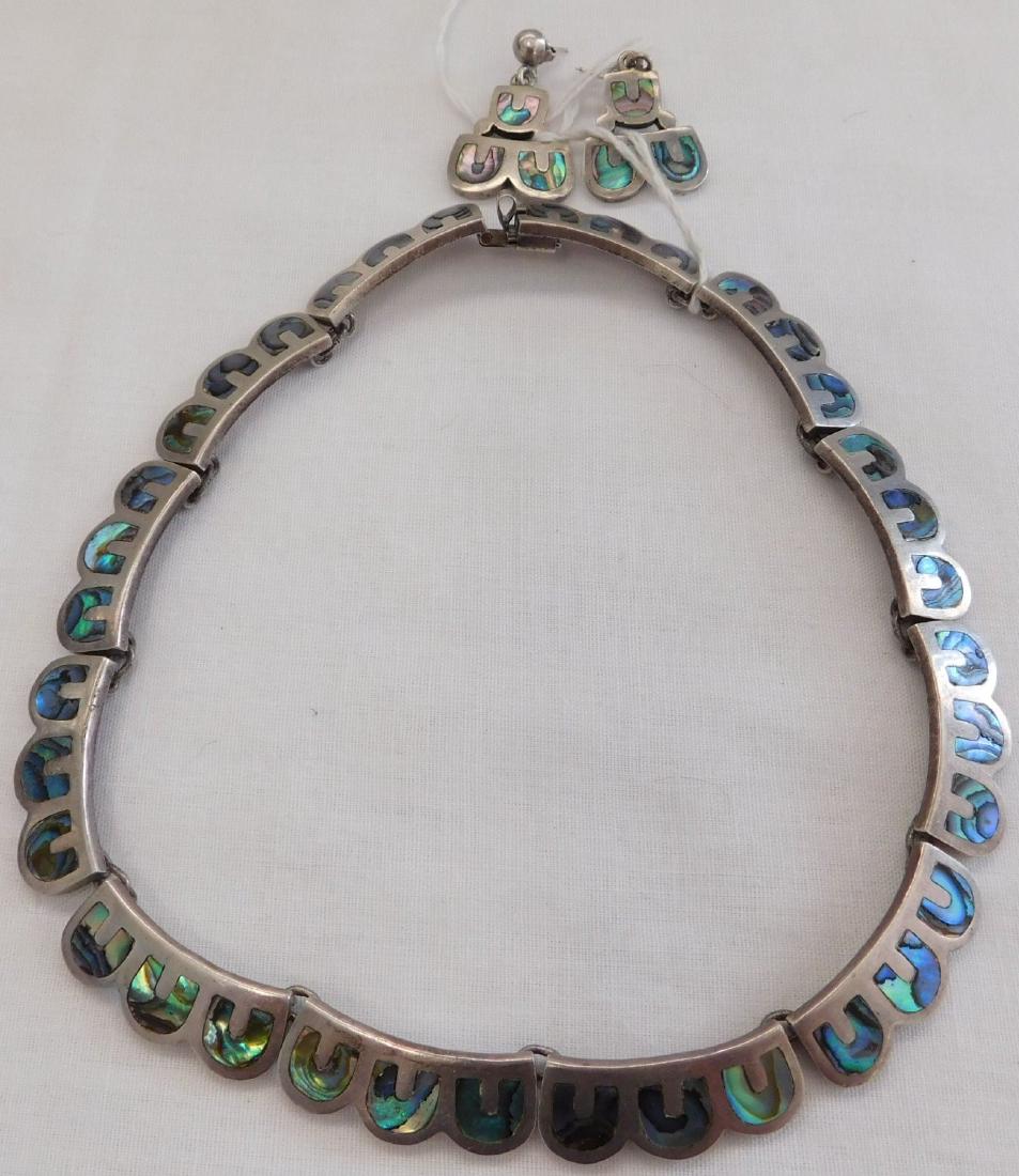 Emma Melendez Sterling Silver & Abalone Jewelry: Emma Melendez Sterling Silver & Abalone Jewelry, circa 1950s. Made of sterling silver and abalone, the necklace measures approx. 15" long when strung out, and earrings measures 1 1/4" each. Items are