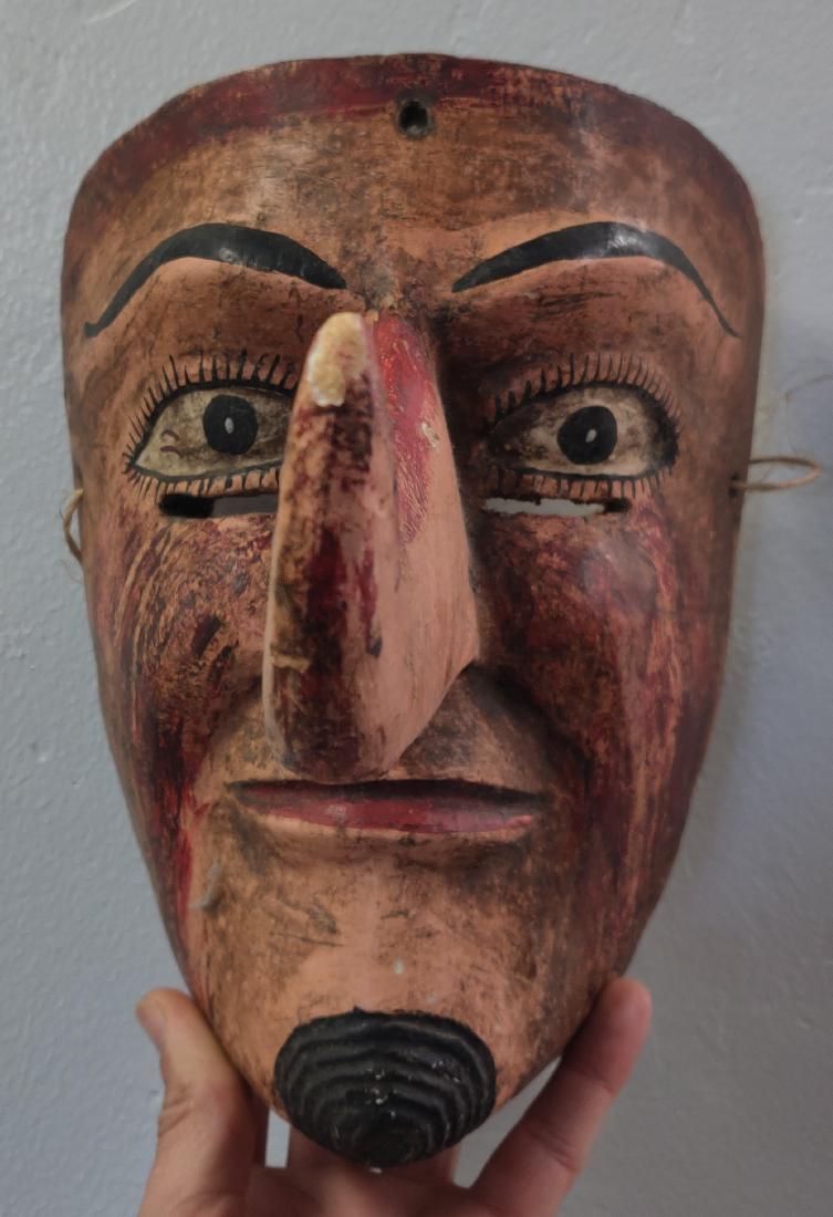 Old Mexican Mask: Old Mexican Mask, c. 1940s. Made of wood and paint, the item measures 11" x 6" x 9". Mexico. Long nose on mask. Condition: Good, minor wear, see images. Shipping: $30.00 w/insurance and signature, due