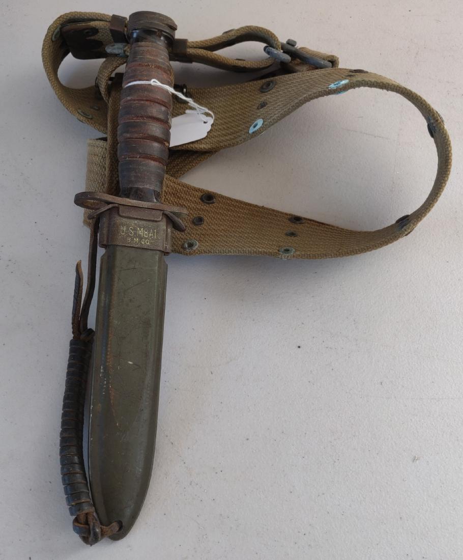 M81A US Bayonet w/Sheath + Belt: M81A US Bayonet w/Sheath + Belt, c. 1950s. Made of steel and leather, the item measures 12" x 3". USA. Condition: Good, see images. Shipping: $20.00 w/insurance and signature.