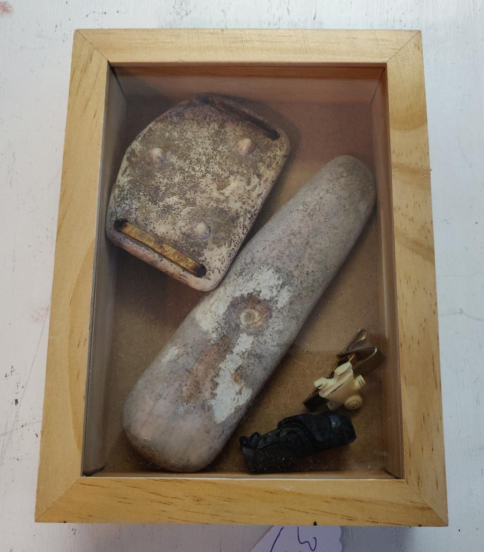 Eskimo Artifact Collection: Eskimo Artifact Collection, pre-historic to historic pieces. Made of fossil bone, the largest item measures 6". Alaska. Brass and bone buckle, small totem carving as well as carved Eskimo figure. Fram