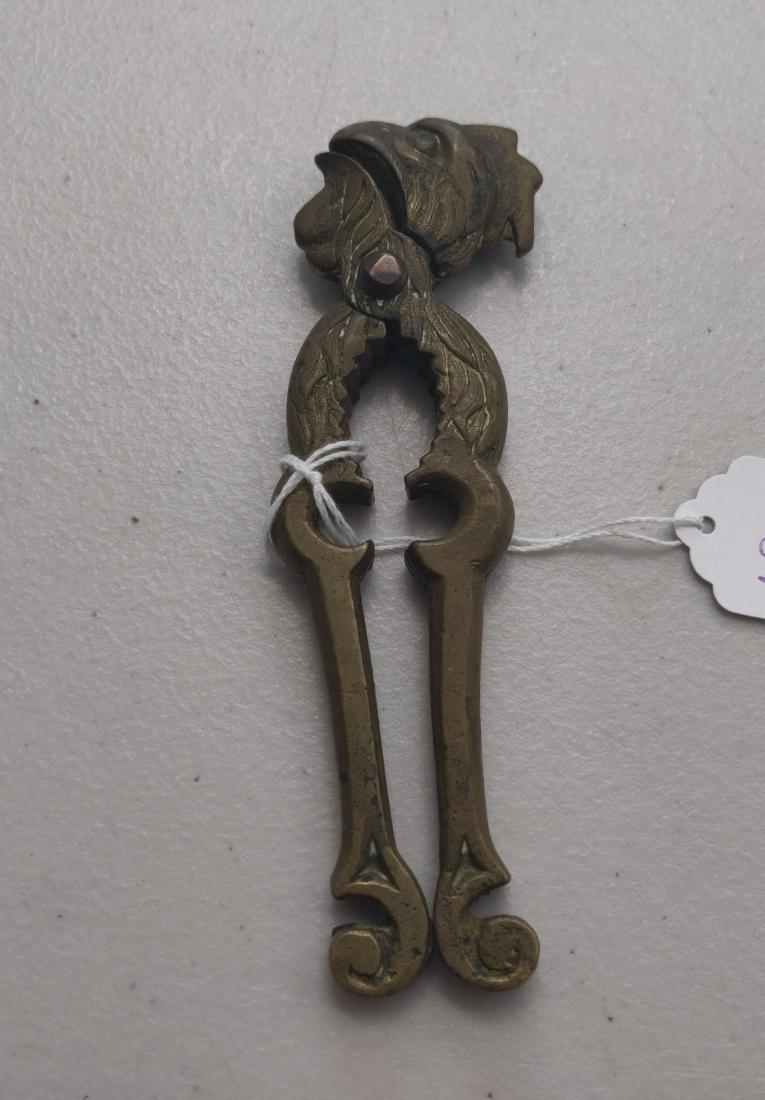 Bronze Nut Cracker: Bronze Nut Cracker, c. 1950s. Made of brass, the item measures 6" x 2". Indonesia. Condition: Patina, see images. Shipping: $12.50 w/insurance and signature.