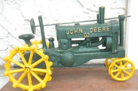 Toys - Antique Tractors: John Deere Toy Tractor Cast Iron. 10x7x5 inches. Great condition. Wheels roll and sterring wheel turns. States John Deere 02. Shipping $18.00