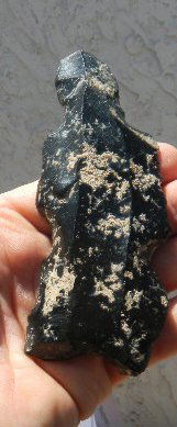 Obsidian Pre-Columbian Human Effigy: This measures 5.5 by 2 by .5 inches. This was found in Colima, Mexico and has lots of mineralization and straw marks. Pre-Columbian. This item is from a long time collector in San Diego. Shipping $12.