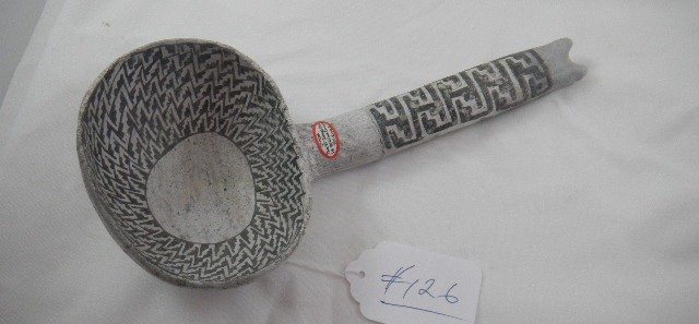 Anasazi Black on White Pottery Ladle: Anasazi Black on White Ladle, Item is 11x5x3 inches with minor repair as handle was broken and glued. Item has data from St. John's area. Shipping is $25.00