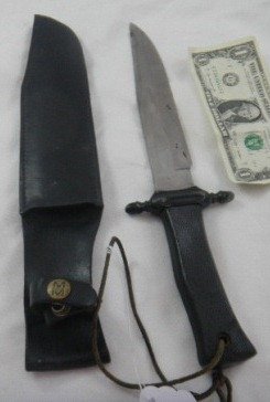 Bowie Knife: Bowie Knife with black leather sheath 13 inches by 3 inches. Viet Nam period. Slight rust. Shipping $14.50