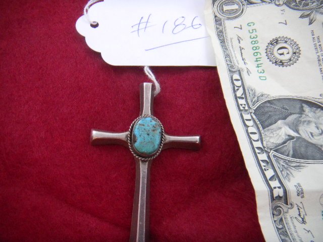 Turquoise and Sterling Cross: Sterling and Turquoise Cross, Large cabochon turquoise stone. Cross measures 1 3/4 x 2 1/2 inches. Condition is fine. Age from 1960's