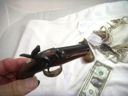 Collection to include 41 Caliber Black Power Derri: Collection to include 41 Caliber Black Power Derringer, with deer hide back containing 41 caliber balls and a copper powder flask. The gun measures about 5 by 3 inches, can be fired, and it has brass 