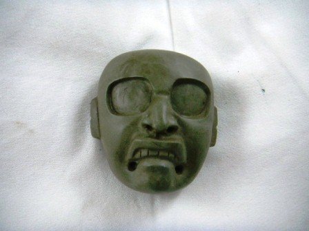 Olmec Stone Maskette: Olmec Stone Maskette, measuring approximately 3 1/2 inches by 3 inches. Item has large chip at top. This item is from Vera Cruz, Mexico. Shipping $18.00