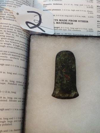 Copper Celt w/documenation: Frame with Copper Celt. The Celt measures 1 1/2 by 3 inches. This item is in Hothem's book on page 170 and is from the ex. Baker collection. The item was found in the Boot Heel Area of Missouri. Condi