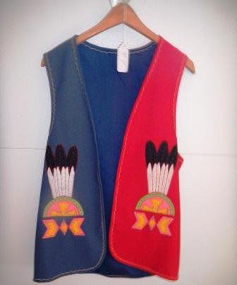 Peyote Ceremonial Vest: Peyote Ceremonial Vest red and blue with Figure designs of peyote fan and peyote rattles. This vest is like new and is from the Smith Collection in Chula Vista and it came from Oklahoma. Item measures