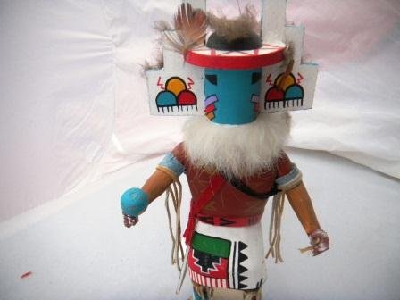 Devil Kachina Doll: Devil Kachina Doll standing 11 inches tall. Doll is signed by H. Bebo. The doll has some paint loss on hands. He has a dance rattle and leather arm and leg bands. Good condition. Shipping and handling