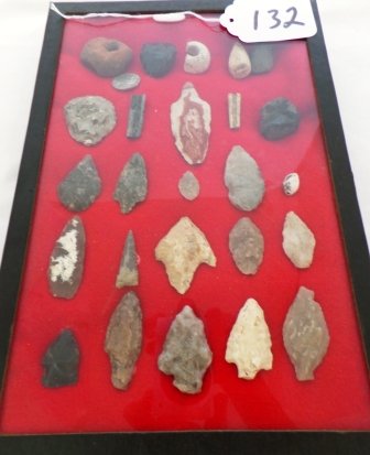 Frame of 25 Chumash Artifacts: Frame of 25 Chumash Artifacts from Santa Maria, CA including beads, arrow points & antique tar balls used to secure arrowheads. Condition: As Found. Shipping: $18.