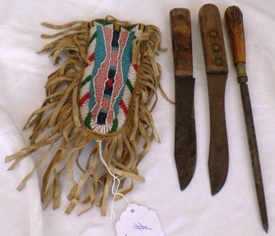 Beaded Kniife Sheath with two Knives and sharpener: Beaded Knife Sheath with two Knives and sharpener. Sioux Tribe. Circa 1940s. Condition: Worn. Shipping: $18.