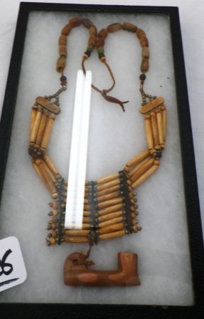 Bead Breast Plate w/Catalinite Pipe: Bead Breast Plate w/Catalinite Pipe. Breast plate is made of beads and bone. Vintage catlinite pipe attached. From Oklahoma in Ryker box. Frame is 8" x 14.5". Condition: Good. Shipping: $12.