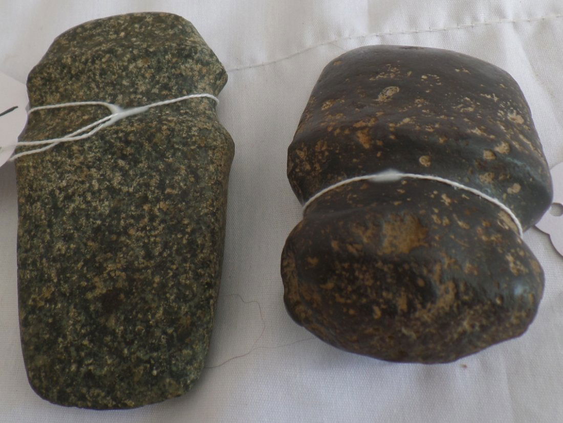 2 Stone Axes: 2 Stone Axes from Missouri, USA. Made of Granite and Hematite, ranging from 4" to 5" long, and 6" - 7 " around. Combined weight of 2.25 lbs. Condition: As Found. Shipping: $15.
