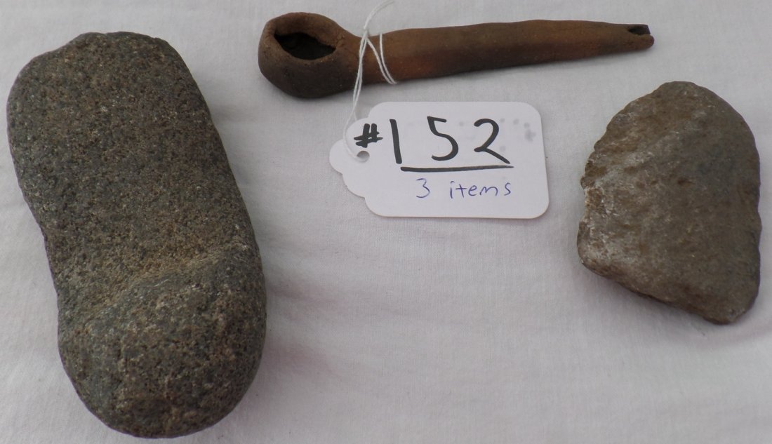 3 Native American Relics: 3 Native American Relics. Found along the U.S.-Mexico border in Southern California. Clay pipe measures 5.5" x 1"; Arrowshaft straightener is 2.75" x 2.5" x 3"; Mano Stone measures 5" x 2.25" x 1.5". 