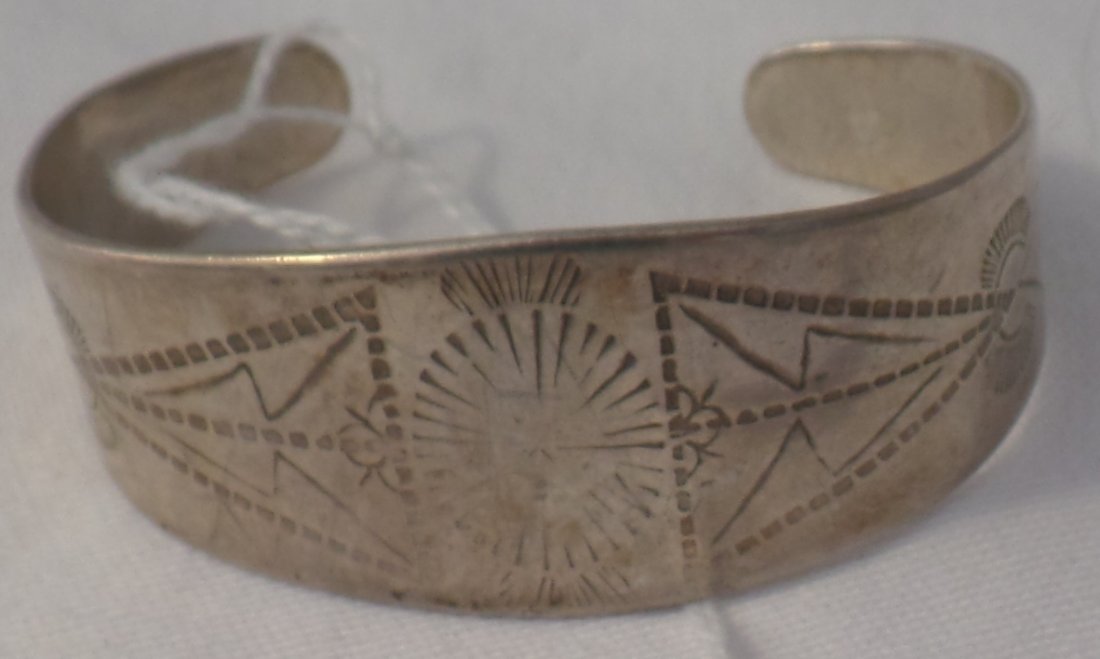 Silver Bracelet-Rocker Work: Silver Bracelet-Rocker Work. Design achieved through rocker work method. Item measures 6" x 1", 1" opening and weighs approx. 30 grams. Condition: Worn, see images. Shipping: $14.