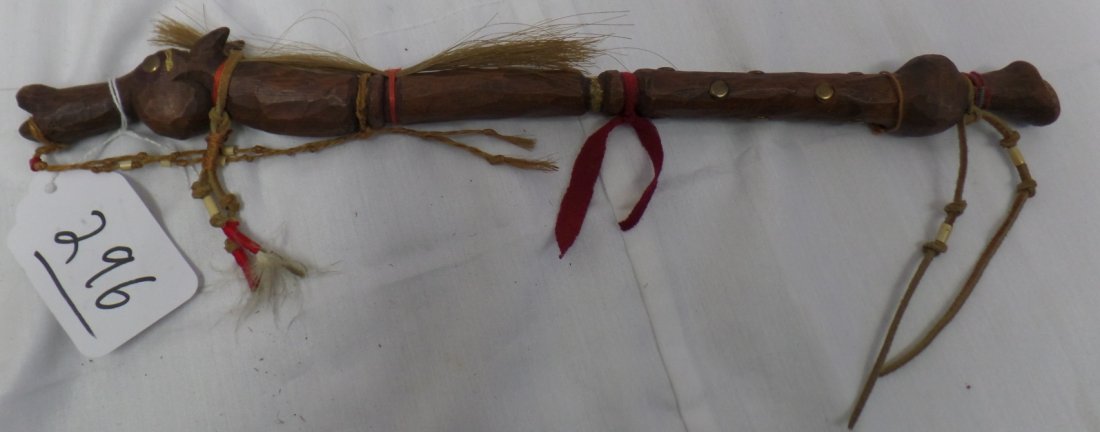 Horse Fetish: Horse Fetish made by the Plains Indians, possibly Crow. Hand-carved wood with metal tacks, horsehair, and leather. Measures 15.75" long. Condition: Very Good. Shipping: $20.