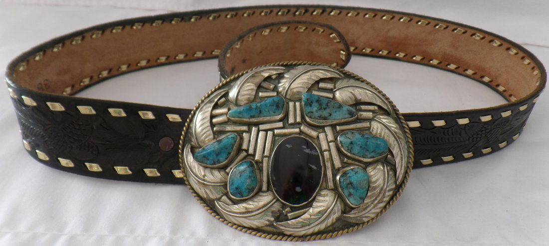 Turquoise & Obsidian Buckle w/Leather Belt: Turquoise & Obsidian Buckle w/Leather Belt. Belt buckle includes snowflake obsidian cabachon and 6 turquoise nuggets and measures 5" x 4.75", buckle is not sterling. The leather belt measures 40.5" lo