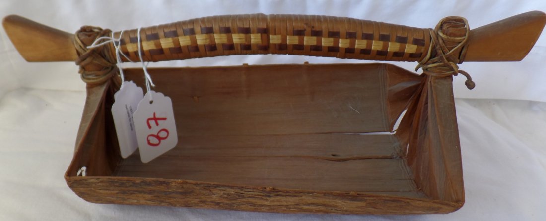 Northwest Coast Bailer: Northwest Coast Bailer, circa 1930. Made of leather ties, cedar and cedar bark. Measures 17" x 8" x 6". Salish tribe, British Columbia, Canada. Nice canoe bailer with imbricated design on handle. Nice