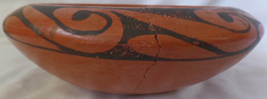 Old Signed Hopi Bowl: Old Signed Hopi Bowl circa 1920-30. Made of clay and measuring 9" x 3.5". Signed by Frida Poleahia but heavily damaged. Piece/sliver missing on shoulder, still displays well. Hopi tribe, north-central