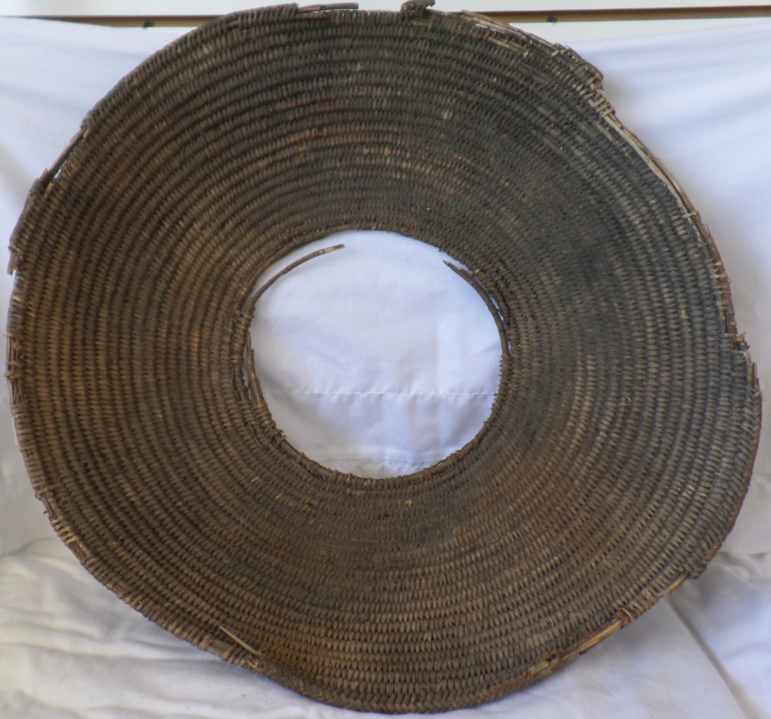 Old Apache Cave Basket: Old Apache Cave Basket, circa 1800s. Made of willow rod and bark. Measures 21" x 5". Found in cave or rock shelter in Arizona. Could be a mortar hopper basket. Apache tribe, North-central Arizona, USA