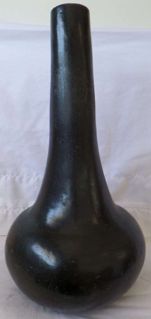 Southwest Blackware Olla: Southwest Blackware Olla, circa 1940-1950s. Made of clay and measuring 17" x 9". Santa Clara, possibly San Ildefenso Pueblo, New Mexico, USA. Very tall water jar with a solid black finish. Smart looki