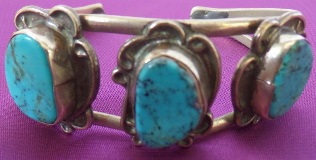 Sterling Silver Bracelet w/Turquoise: Sterling Silver Bracelet w/Turquoise, circa 1950s. Made of Sterling Silver and turquoise. Measures 6 1/2" x 1". Navajo Indian. Nice 3 stone bracelet with good age. Nice blue stones. From the D. Harvey