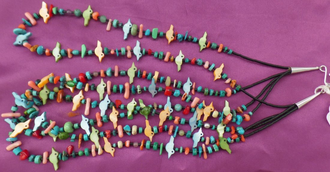 Santo Domingo Necklace: Santo Domingo Necklace of shell, Sterling Siver and Turquoise. This Native American has four strands of multi colored stones and is 22 inches long. Good Condition. D. Harvey Collection. Shipping $18.0