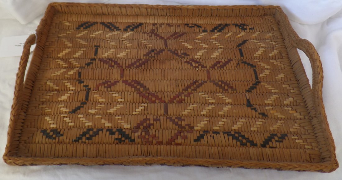 Salish Serving Tray: Salish Serving Tray circa 1940s, made of cedar bark and cedar wood. Item measures 18" x 11" x 3.5". Salish tribe, British Columbia, Canada. 3-color imbricated design. Handles are in good shape. Displa