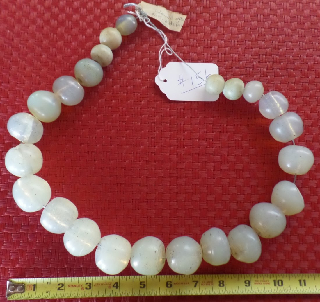 African Opal glass trade beads: This 26 inch strand of African Opal glass beads are from 1850's and may be from Algeria. These rare old clear and opal glass beads are highly collectible. From Helm/Harvey collection. Shipping $16.00