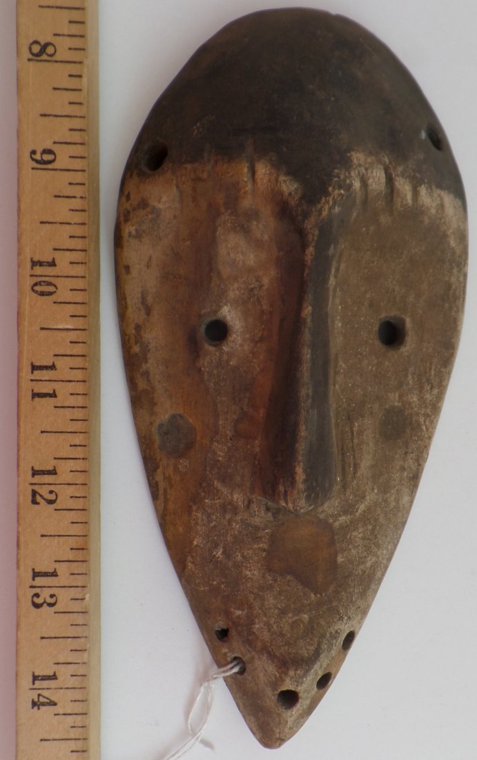 Antique African Passport Wood Mask: Antique African Passport Wood Mask. Circa 1900. Made of wood and paint. Measures 7.75" x 3.75". Lega tribe. Antique collectable African mask. Condition: Heavy patina suggests good age. Shipping: $16.