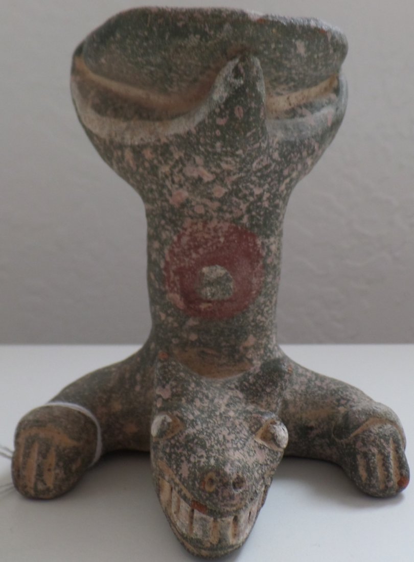 Mayan Effigy Bowl: Mayan Effigy Bowl is around 1000 years old. Bowl is made of clay and paint and measures 4" x 3" x 3". Mayan artifact, from Guatemala. Very unusual style as the bowl is a dog holding a dish or bowl wit