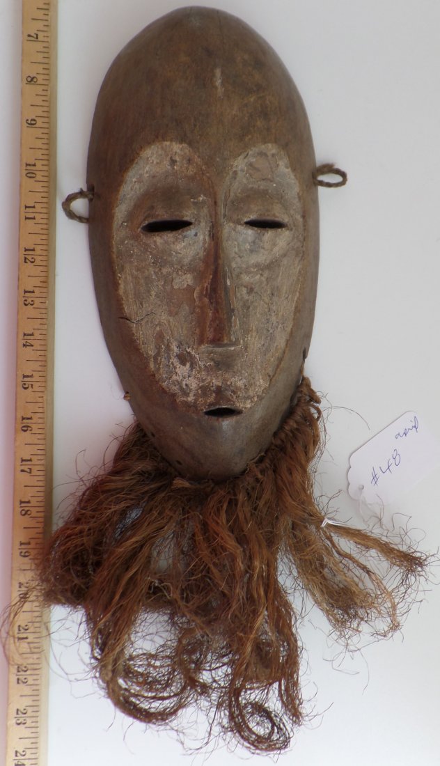 Antique African Wood Mask: 1920s Antique African Wood Mask measuring 15" x 6". From the Congo. Condition: Minor nicks and scratches, see images. Shipping: $20.