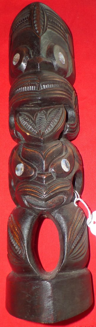 New Zealand Wood Tiki: Fine Classic carving of a new Zealand Wood Tiki from the 1950's. This item is made from wood, abalone and shell and Measures 14 x 3 3/4 inches. The item is from Moari and is in nice condition with min