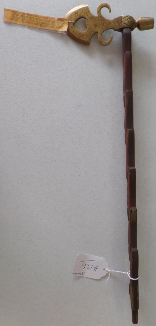 Brass Pipe Tomahawk: 20th Century Brass Pipe Tomahawk measuring 22x6x 11/2 inches. There is some patina, stains and scratches. Believed to be from Dakotas. Please note the horse hoofs on the stem. Shipping: $20.00