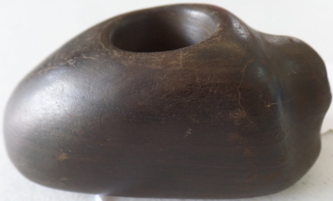 Stone Beaver Pipe Bowl: Prehistoric Stone Beaver Pipe Bowl made from fine dark basalt. This Minnesota, Clay County Item measures f3 3/4 x 2 x 1 1/2 inches . There is use wear and minor nicks and scratches. Please note it has