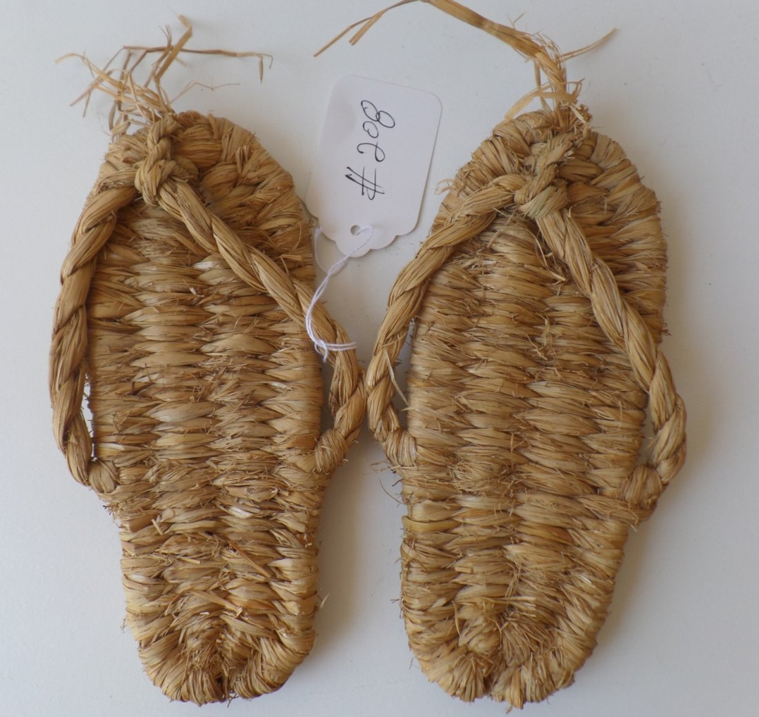 Pair of Fiber Sandals: Pueblo pair of fiber sandals made in the 1900's from Yucca. The sandals measure 8 x 3 inches and show some wear. Shipping $14.50