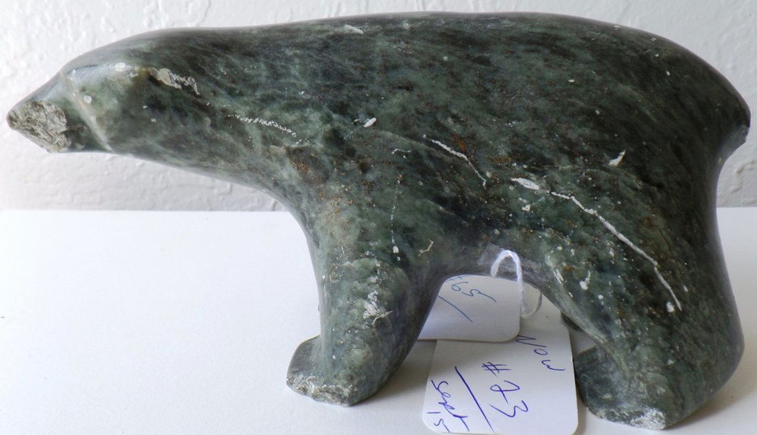 Eskimo Stone Carving: 1960s Eskimo Stone Carving made of steatite and measures 8" x 5" x 2". Signed Eskimo Made, Ben Sail Evanan (?). Condition: Has damaged nose, left foot and tail. Also nicks and scratches, see images. S